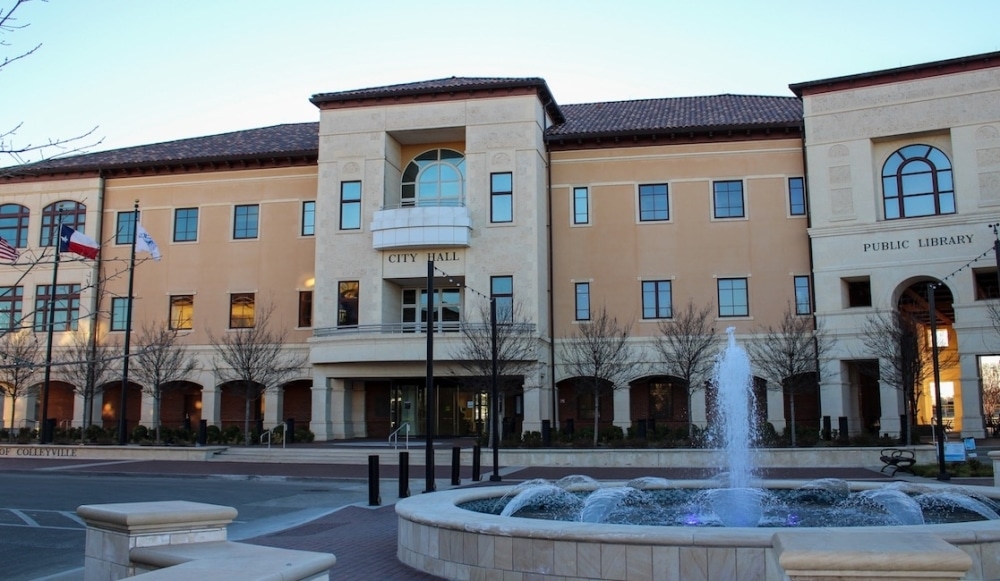 Front view of Colleyville City Hall with a fountain and well-maintained landscaping, showcasing professional Colleyville lawn care and maintenance.