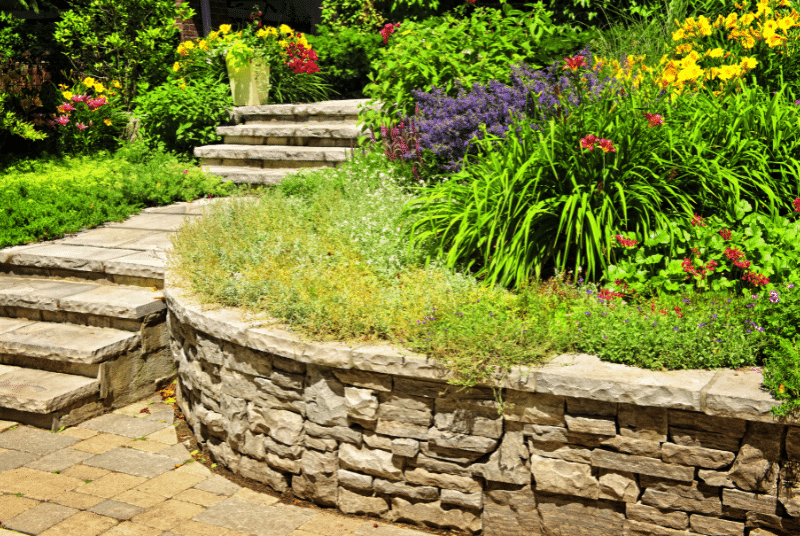 Southlake landscape maintenance with mulched flower beds, trimmed plants, and clean edges in a residential yard.