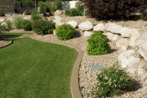Westlake landscape maintenance with trimmed bushes, decorative rocks, and a well-kept yard at a residential home.